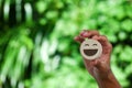 Hand holding wood happy smile face. Concept of positive thinking, mental health Royalty Free Stock Photo