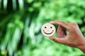 Hand holding wood happy smile face. Concept of positive thinking, mental health Royalty Free Stock Photo