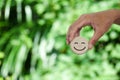 Hand holding wood happy smile face. Concept of positive thinking, mental health Royalty Free Stock Photo