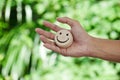 Hand holding wood happy smile face. Concept of positive thinking, mental health Royalty Free Stock Photo