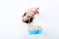 Hand holding wooden camera toy Royalty Free Stock Photo