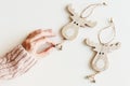 Hand holding wooden Christmas ornaments, white background Royalty Free Stock Photo