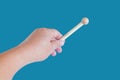 Hand holding a Woodenstick ,drumstick on background Royalty Free Stock Photo