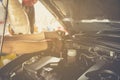 Hand holding a wrench with a car repairs ,professional auto mechanic Royalty Free Stock Photo