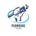 Hand holding a wrench, plumbing service