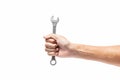 Hand holding a wrench tools, spanners in a man hand on white ba Royalty Free Stock Photo