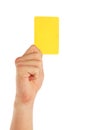 Hand holding yellow card