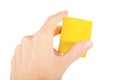 Hand holding a yellow cube, man gripping, reaching and grabbing a floating part, node, catching a hovering cube gesture isolated Royalty Free Stock Photo