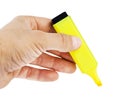 Hand holding yellow highlighter Royalty Free Stock Photo