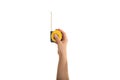 Hand holding a measuring tape on white background Royalty Free Stock Photo