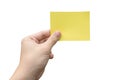 Hand holding yellow paper isolated on white with clipping path Royalty Free Stock Photo