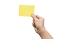 Hand holding yellow paper isolated on white with clipping path Royalty Free Stock Photo