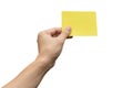 Hand holding yellow paper isolated on white with clipping path Royalty Free Stock Photo