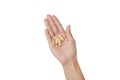 Hand holding yellow pill isolated on white background Royalty Free Stock Photo