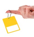 Hand holding yellow price tag Royalty Free Stock Photo