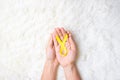 Hand holding Yellow Ribbon on white background for supporting people living and illness. September Suicide prevention day, Royalty Free Stock Photo