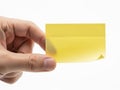 Hand holding yellow sticky note isolated on white background Royalty Free Stock Photo