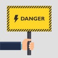 Hand holding yellow stop danger sign. Flat style design. Vector illustration. Royalty Free Stock Photo