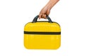 Hand holding yellow suitcase  on white background.Time to Travel  around the world, Road trip vacation. Tourism or Journey concept Royalty Free Stock Photo