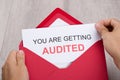 Hand holding you are getting audited card Royalty Free Stock Photo