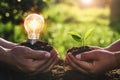 hand holding young plant and ligh bulb. concept saving energy. eco earth day Royalty Free Stock Photo