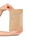 Hand holding zip-lock kraft paper bag. Ziplock pouch, craft eco package, soft pack