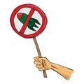 Hand holds a banner prohibiting weapons. Sign prohibition of nuclear missiles and nuclear testing.
