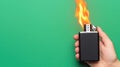 Burning Lighter in Hand Green Background Flame Fire Copy Space Royalty Free Stock Photo