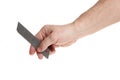 Hand holds a blade for a construction knife on a white background Royalty Free Stock Photo