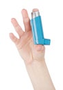 Hand holds blue asthma inhaler for relief asthma Royalty Free Stock Photo