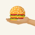 Hand holds burger cartoon vector illustration. Fast food with hamburger isolated on white advertisement. Beefburger Royalty Free Stock Photo