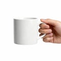 A hand holds a classic white ceramic coffee mug against a plain background Royalty Free Stock Photo