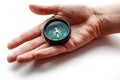 The hand holds a compass. Closeup. Isolated on a white background Royalty Free Stock Photo