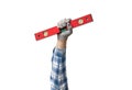 hand holds a construction tool spirit level Royalty Free Stock Photo