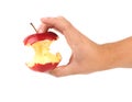 Hand holds core of an apple. Royalty Free Stock Photo