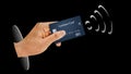 A hand holds a credit card capable of contactless payments via near field communications