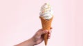 Hand holds delicious vanilla ice cream cone on a pink background with copy space. Generative AI
