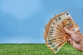 Hand holds 50 euro banknotes in a fan