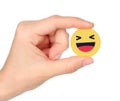 Hand holds Facebook Haha Empathetic Emoji Reaction