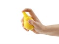 Hand holds fresh lemon with citrus juice sprayer, presses spray button, isolated on white Royalty Free Stock Photo