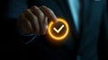 Hand holding glowing check mark icon in a dark background setting