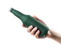 The hand holds a green frosted beer bottle. Close up. Isolated on a white background Royalty Free Stock Photo