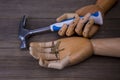 Hand holds a hammer and a few nails Royalty Free Stock Photo