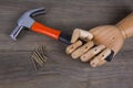 Hand holds a hammer and nails Royalty Free Stock Photo