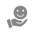 Hand holds happy emoji, good mood gray icon. Share positive emotions symbol