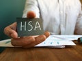 Hand holds Health Savings Accounts HSA inscription
