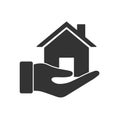 Hand holds house. vector gray colour icon