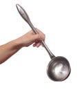Hand holds a ladle (kitchen spoon)