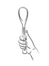 Hand holds long wooden spoon. Kitchen accessory large bamboo spoon. Eco-friendly utensils for cooking sauces, soups, liquid dishes