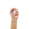 The hand holds a lump of white paper. Isolated on white background